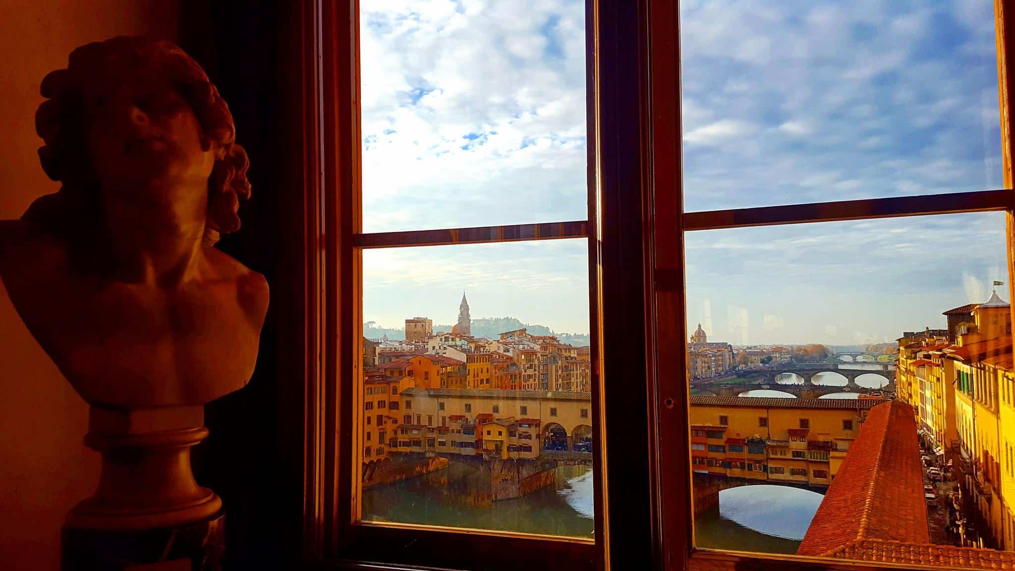 View of the Arno river and Ponte Vecchio bridge from Uffizi Gallery Florence Italy