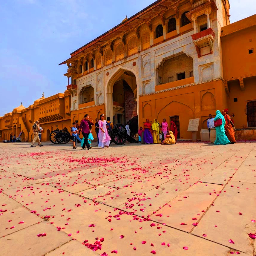 The entrance with flowers to Amber Fort a magnificent palace complex located on a hilltop overlooking the city Jaipur India