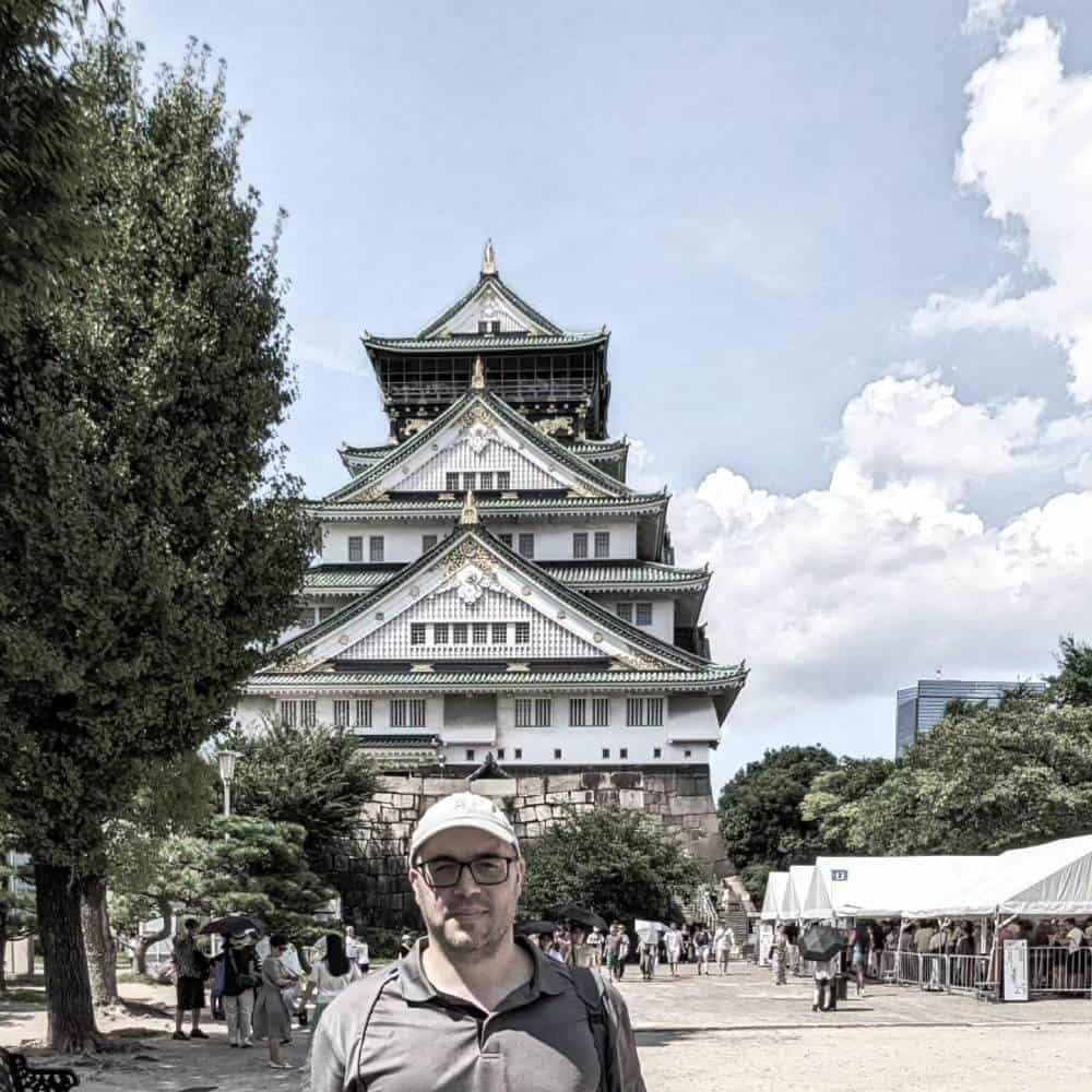 Isaac in front of Osaka Castle in Osaka, Japan - Things To Do And See