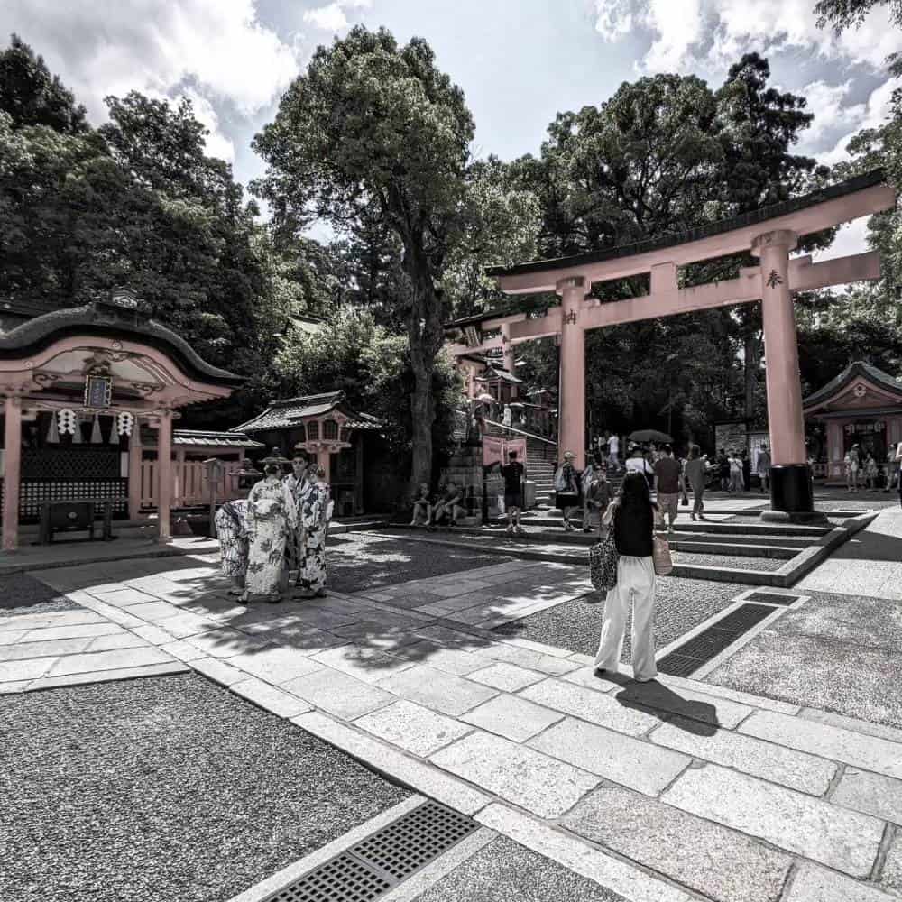 entrance with people in traditional dress Fushimi Inari Taisha Kyoto, Japan - Things To Do And See