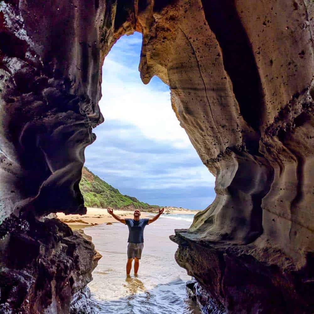 cave view with beach and Isaac near central coast nsw